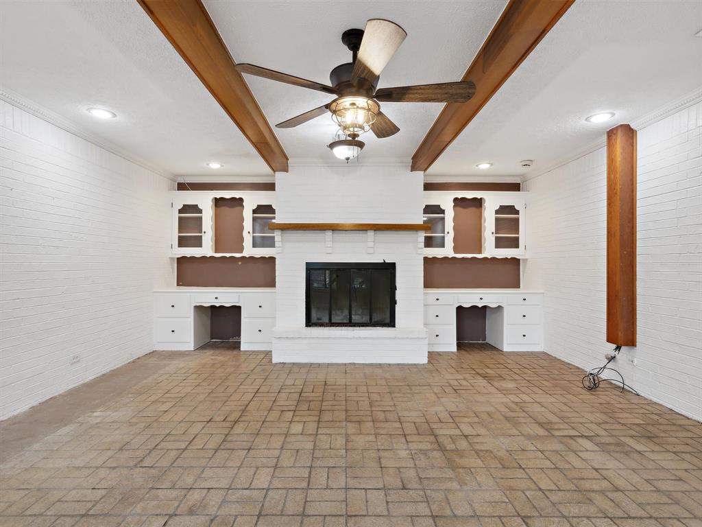 1302 Forreston Road Waxahachie, TX 75165 - Photo 21 of 39 a view of an empty room with a fireplace