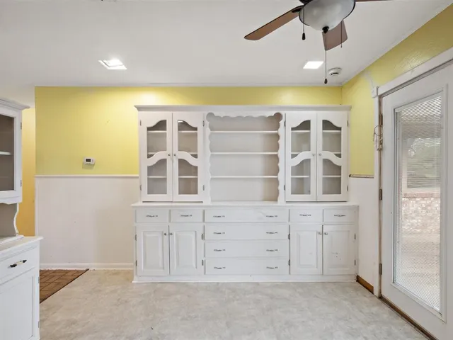 a kitchen with a refrigerator and a sink
