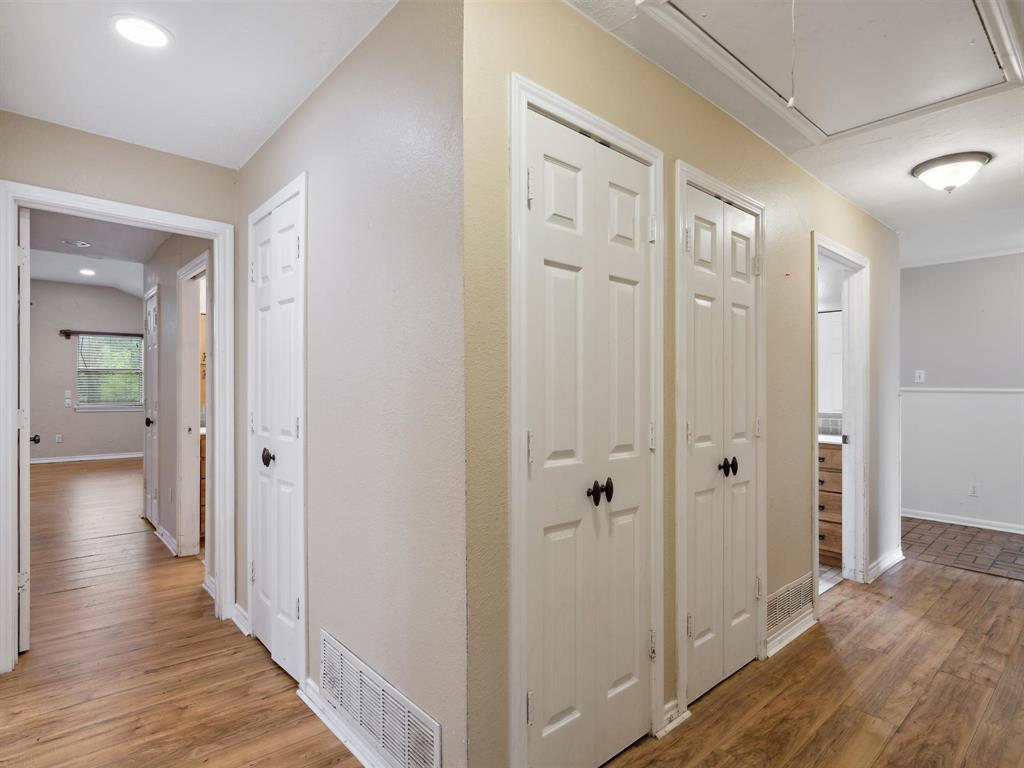 1302 Forreston Road Waxahachie, TX 75165 - Photo 32 of 39 a view of a hallway with wooden floor