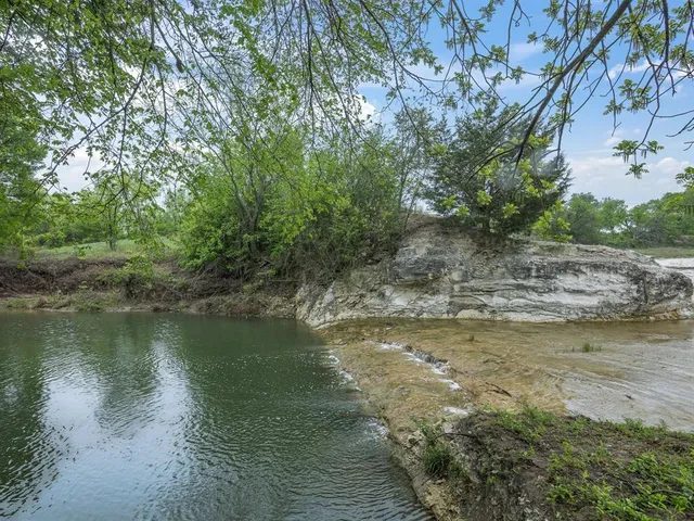 a view of a lake from a yard