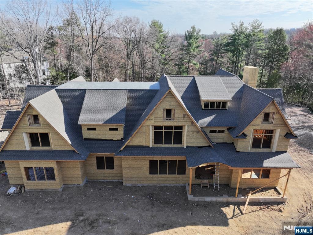 a aerial view of a house with a yard