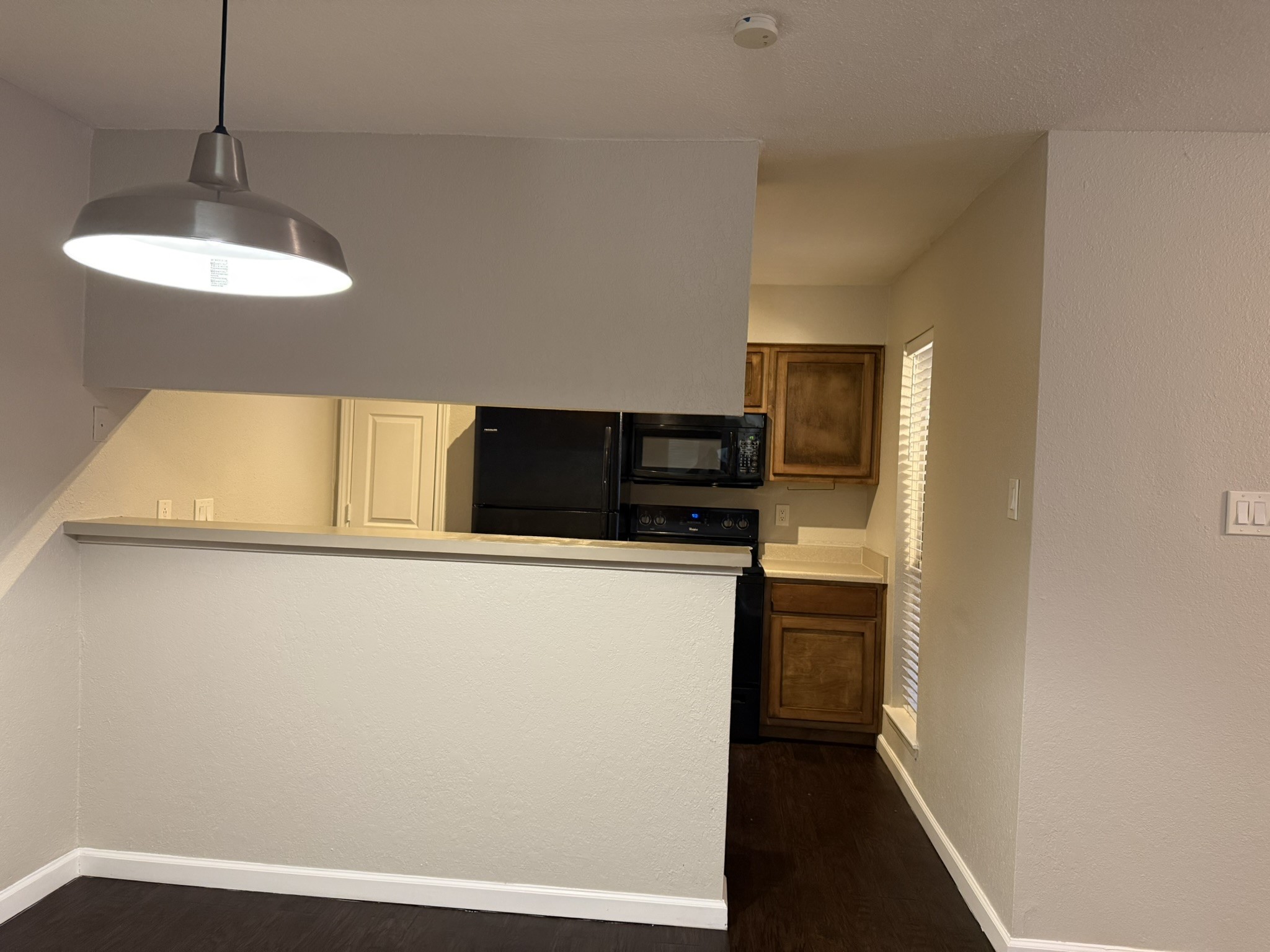 16303 Lyons School Road, Unit 304 Spring, TX 77379 - Photo 8 of 17 a kitchen with stainless steel appliances a refrigerator and a stove