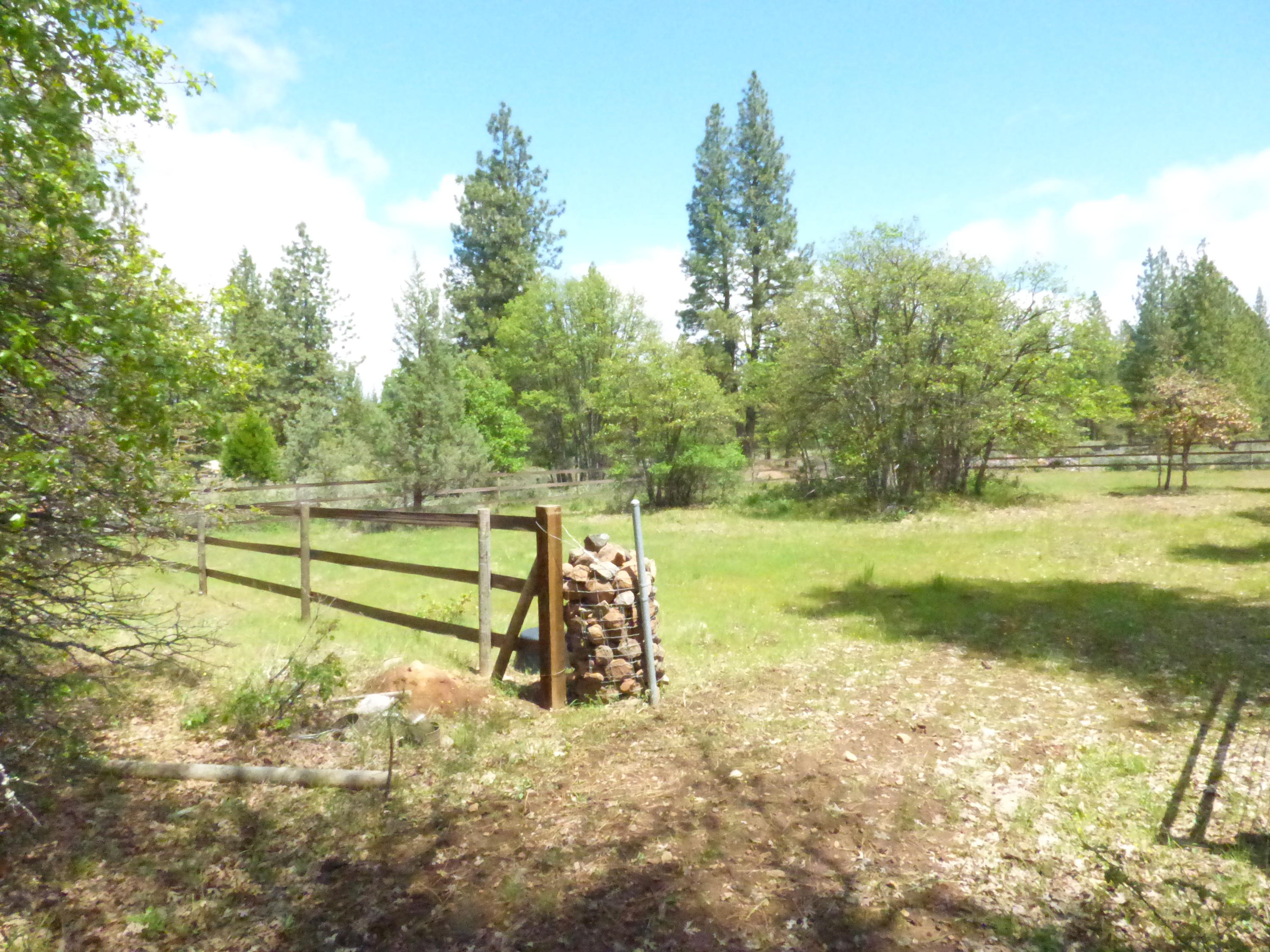 Hawkins Mill Road Fall River Mills, CA 96028 - Photo 4 of 12 a view of a yard with wooden fence