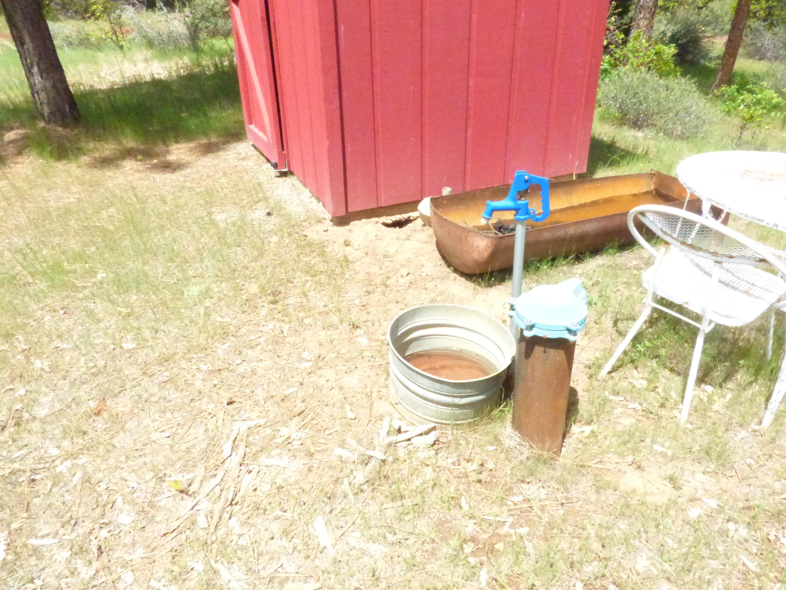 Hawkins Mill Road Fall River Mills, CA 96028 - Photo 9 of 12 a view of a backyard with table and chairs