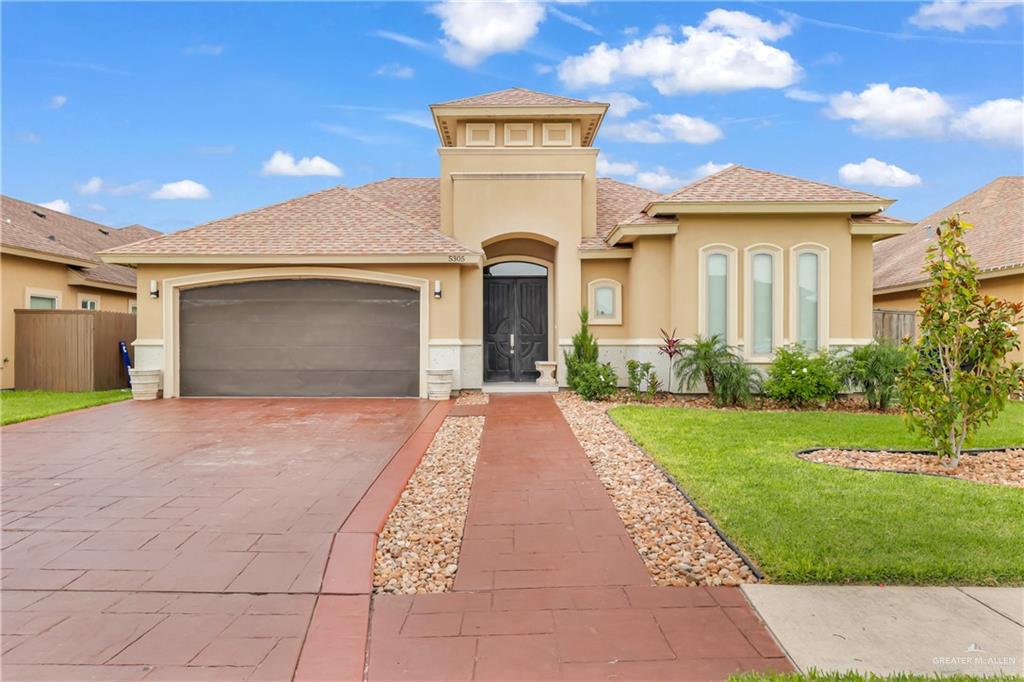 5305 North 46th Street McAllen, TX 78504 - Photo 1 of 1 a front view of a house with a garden and plants