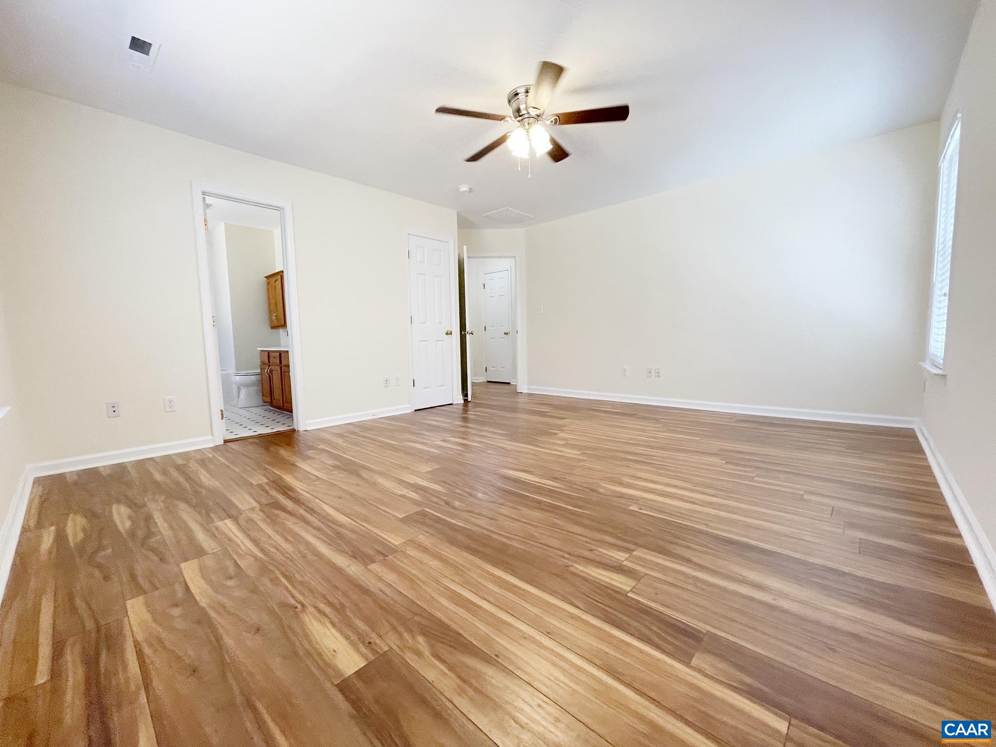 216 Rudolph Street Ruckersville, VA 22968 - Photo 18 of 39 an empty room with wooden floor and windows