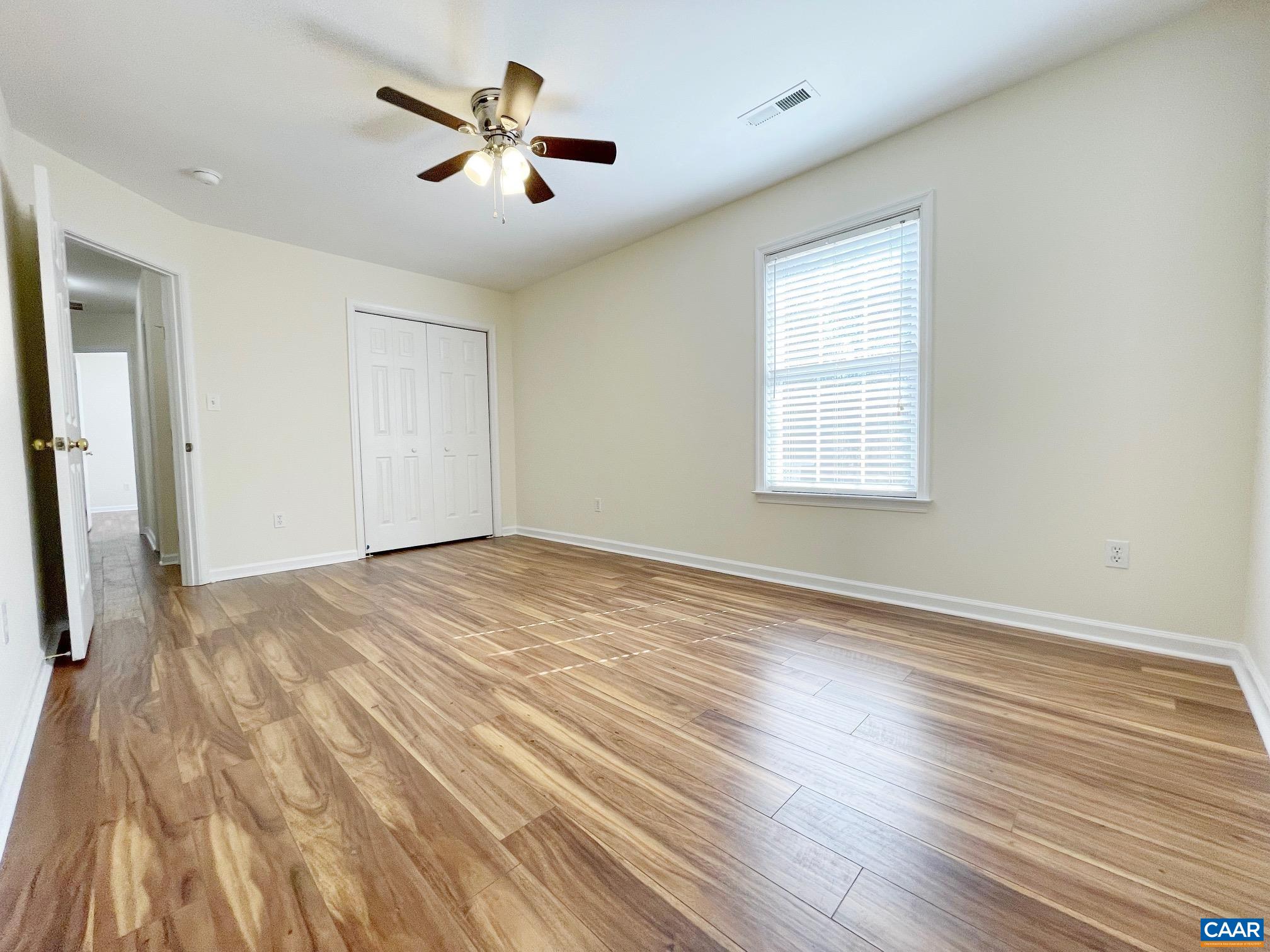 216 Rudolph Street Ruckersville, VA 22968 - Photo 22 of 39 an empty room with wooden floor and windows