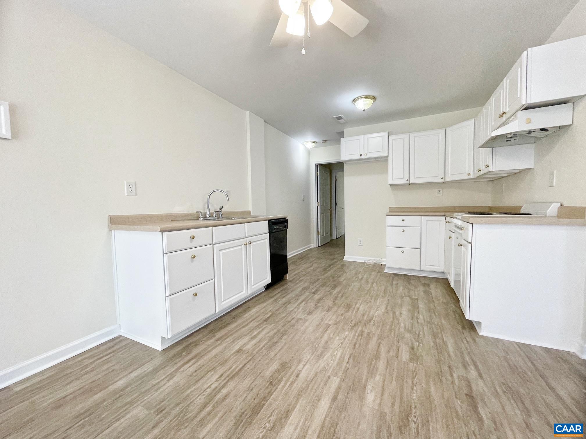 216 Rudolph Street Ruckersville, VA 22968 - Photo 28 of 39 a kitchen with stainless steel appliances a sink cabinets and wooden floor