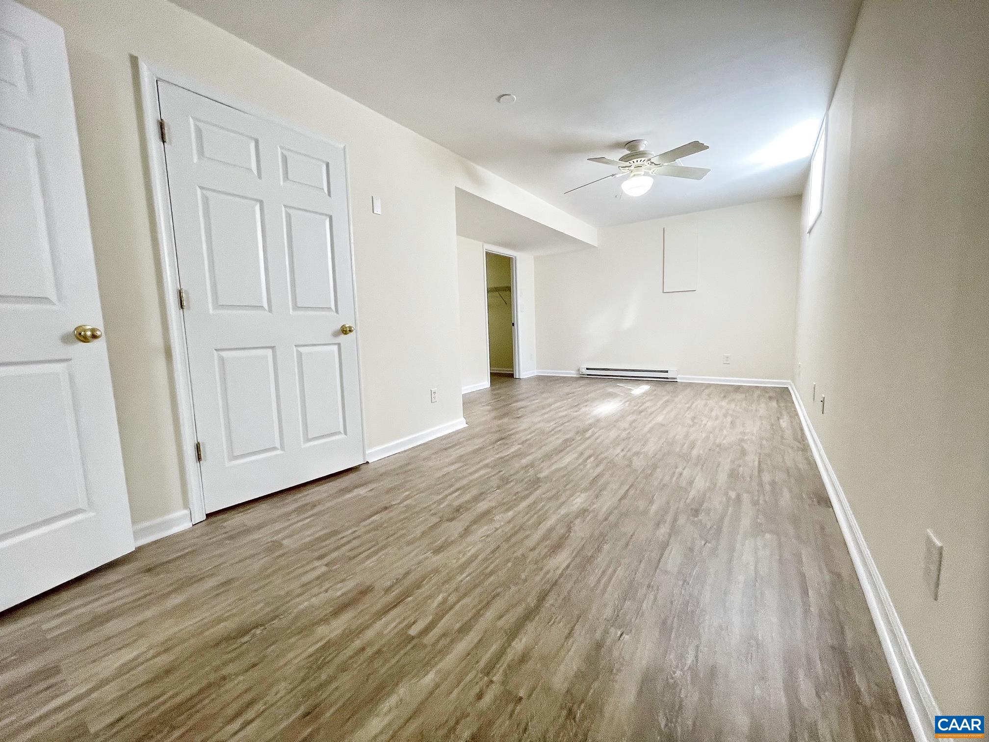 216 Rudolph Street Ruckersville, VA 22968 - Photo 29 of 39 a view of an empty room with wooden floor