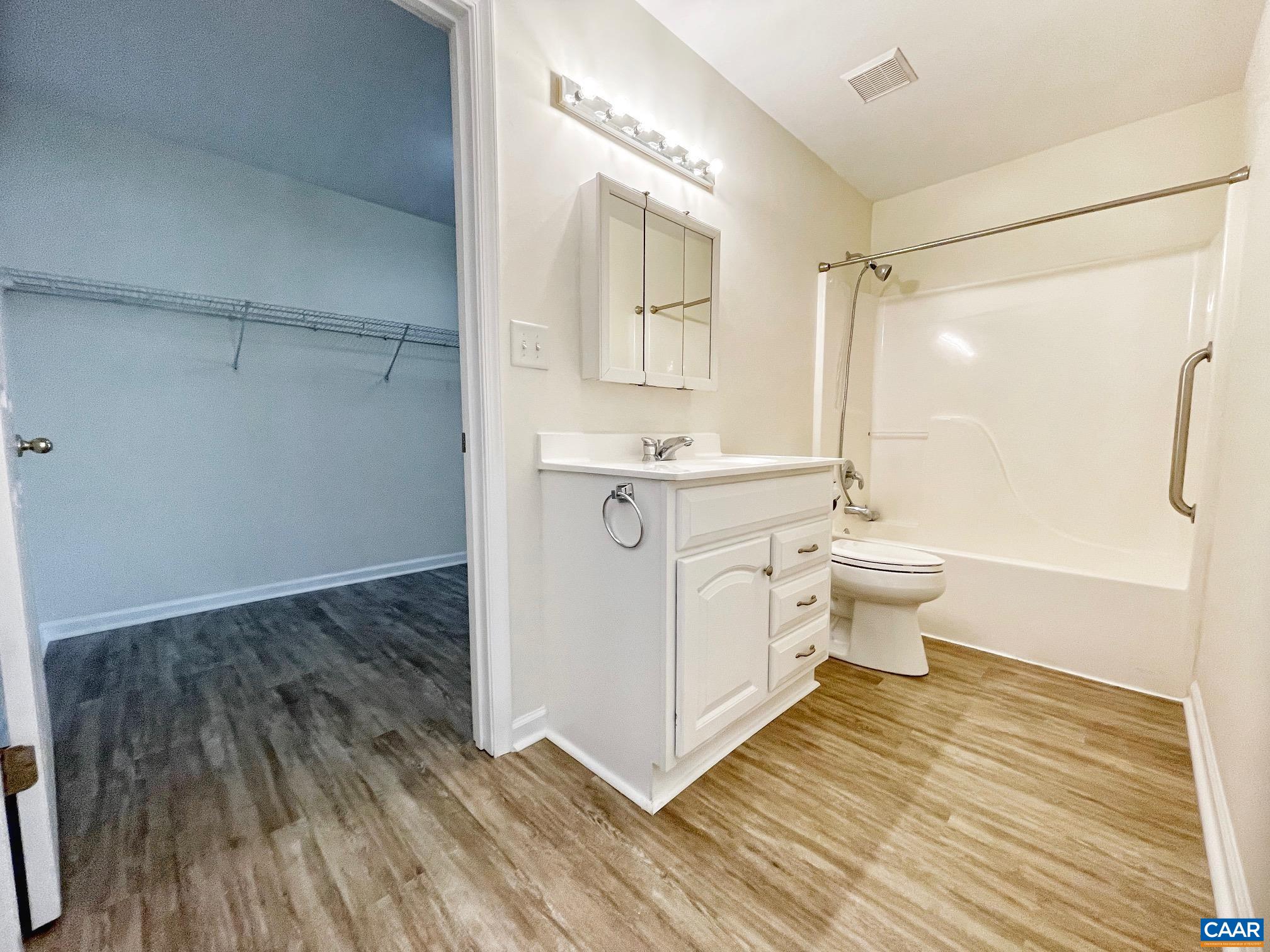 216 Rudolph Street Ruckersville, VA 22968 - Photo 31 of 39 a bathroom with a sink a mirror and a shower