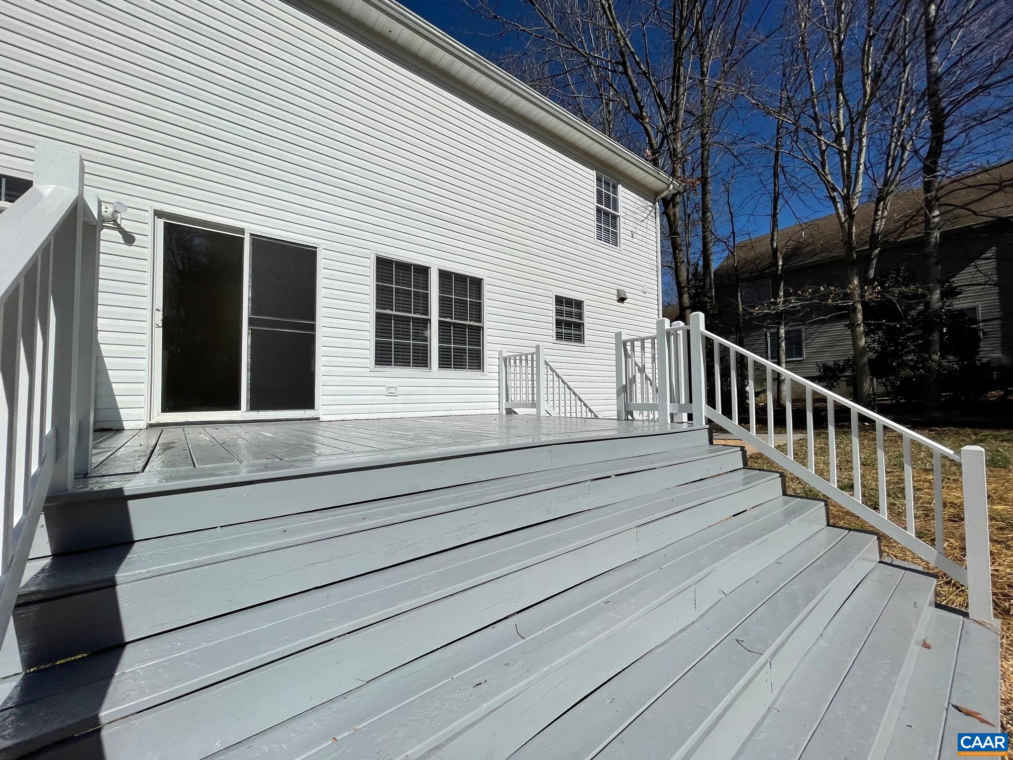216 Rudolph Street Ruckersville, VA 22968 - Photo 37 of 39 a view of house with wooden deck and a large window