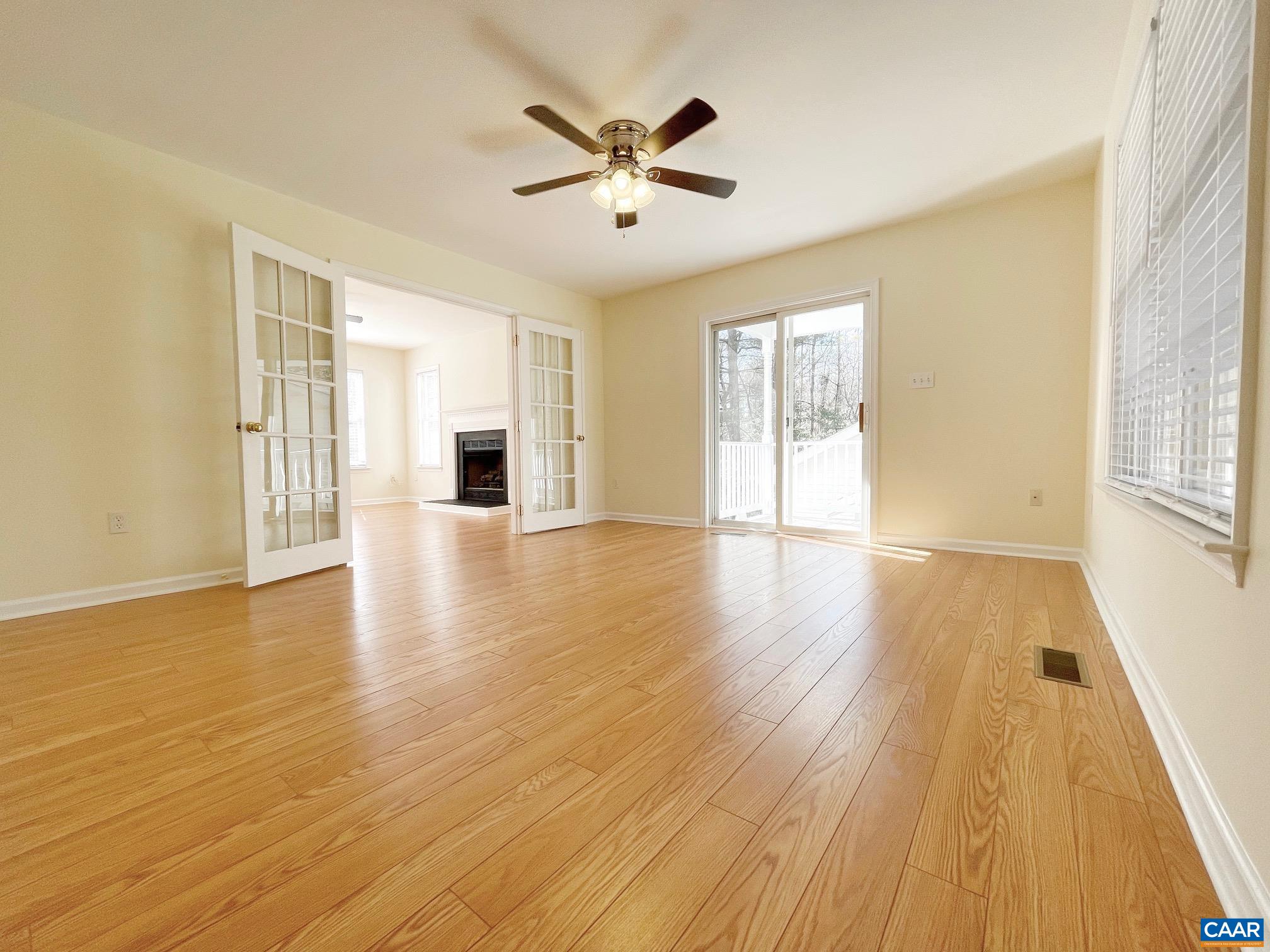 216 Rudolph Street Ruckersville, VA 22968 - Photo 7 of 39 a view of empty room with wooden floor and ceiling fan
