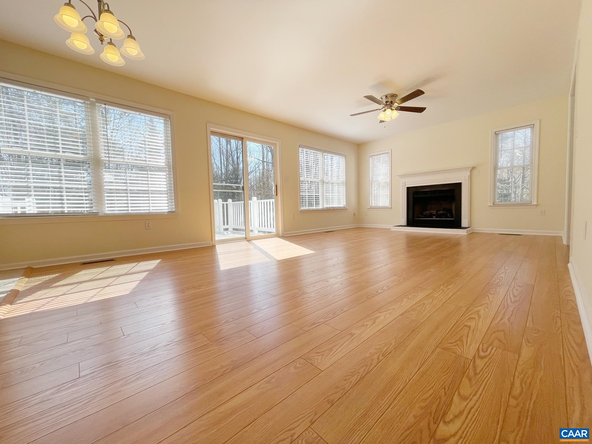 216 Rudolph Street Ruckersville, VA 22968 - Photo 9 of 39 a view of an empty room with wooden floor and a window