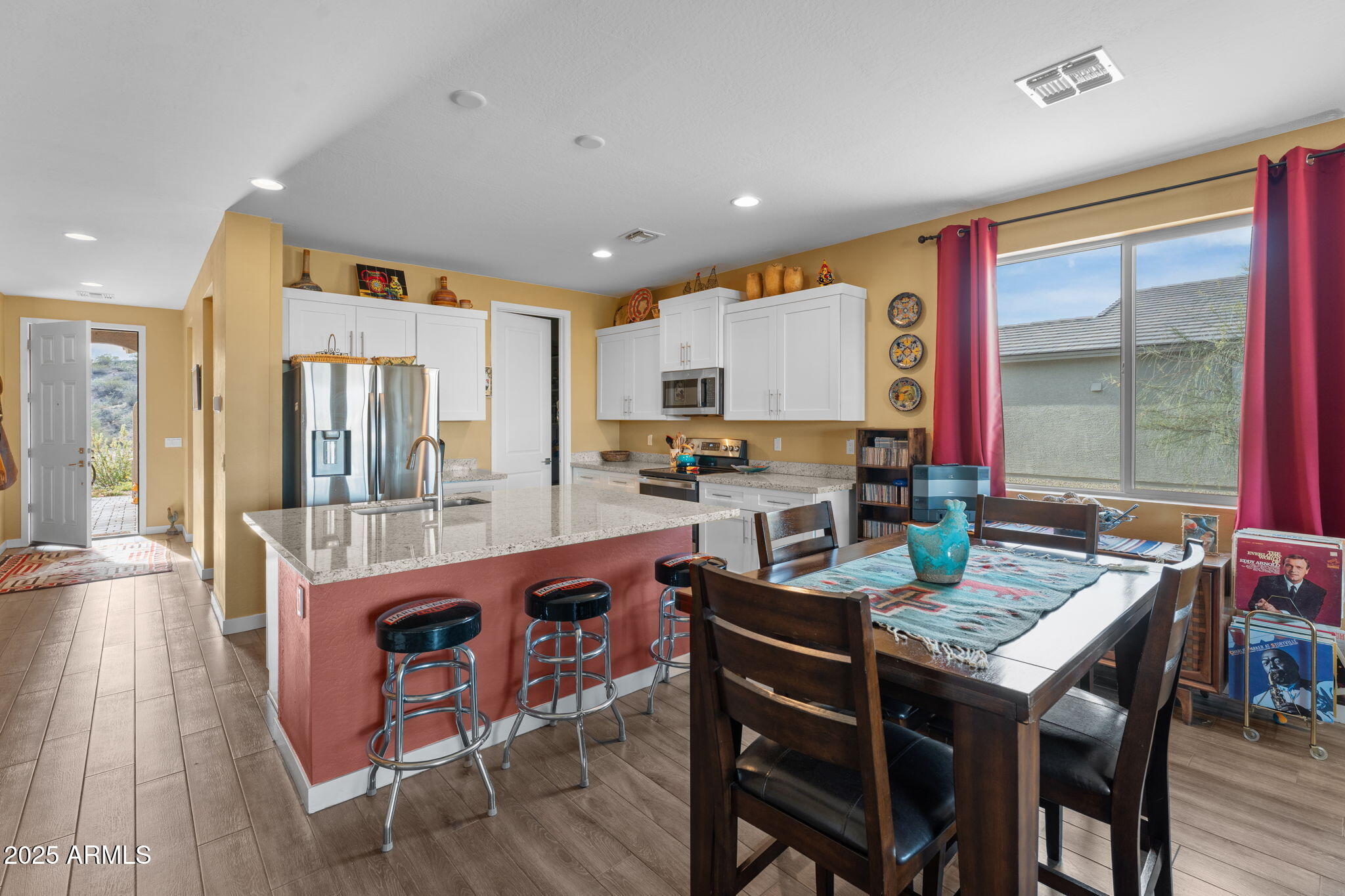 1900 West Ringo Road Wickenburg, AZ 85390 - Photo 14 of 37 a large kitchen with dining table and chairs