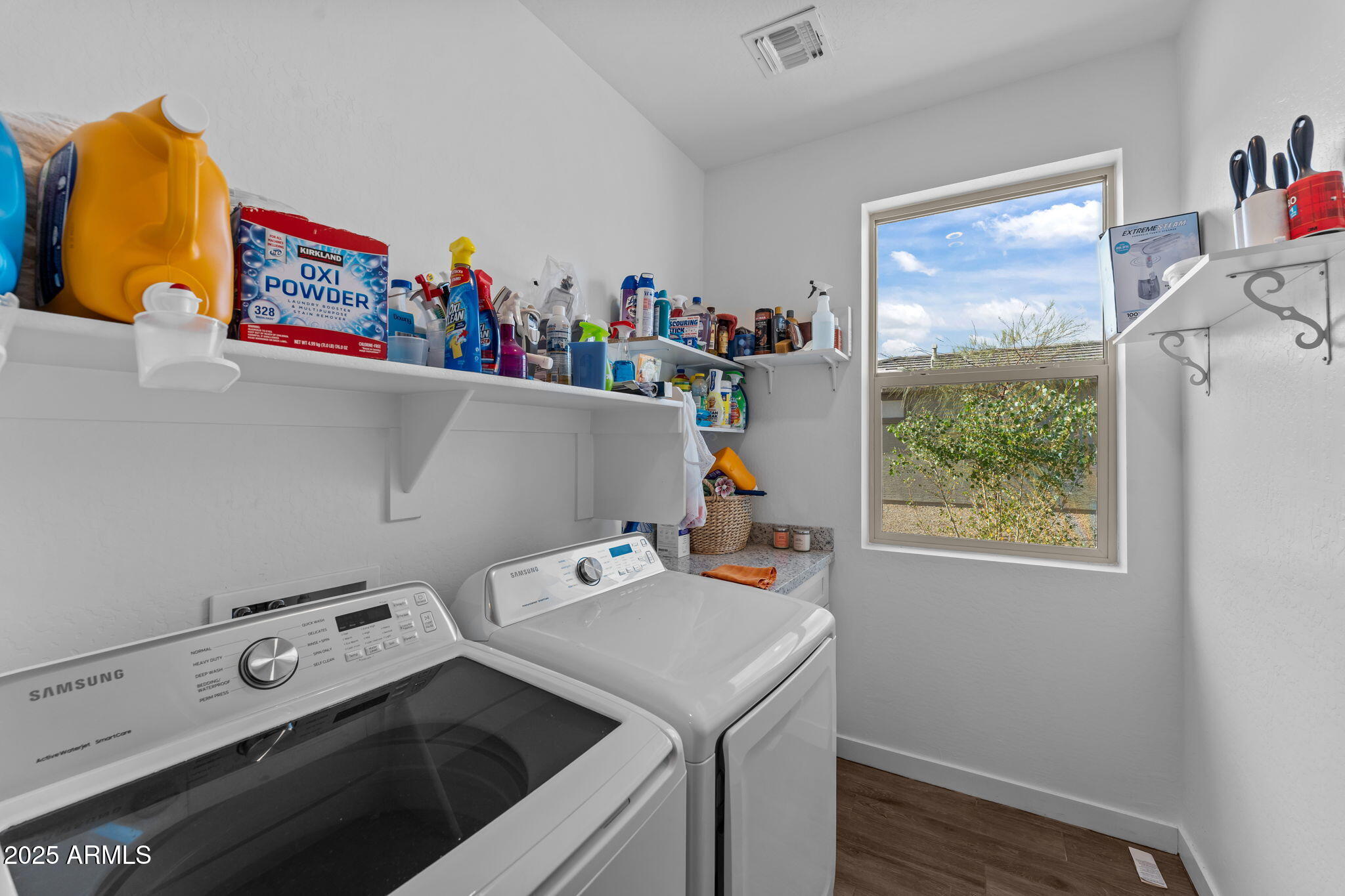 1900 West Ringo Road Wickenburg, AZ 85390 - Photo 24 of 37 a utility room with dryer washer and a window