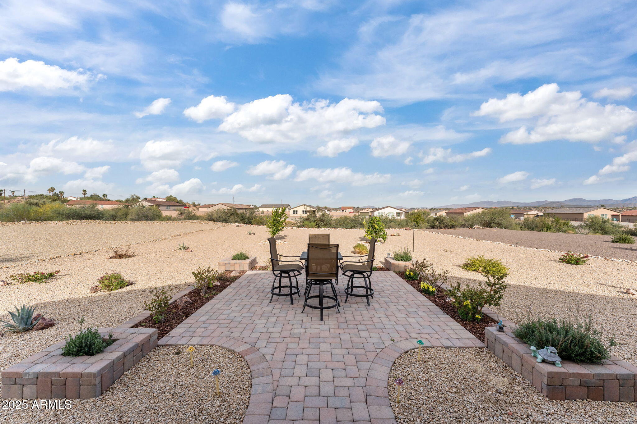 1900 West Ringo Road Wickenburg, AZ 85390 - Photo 28 of 37 a view of a lake with table and chairs