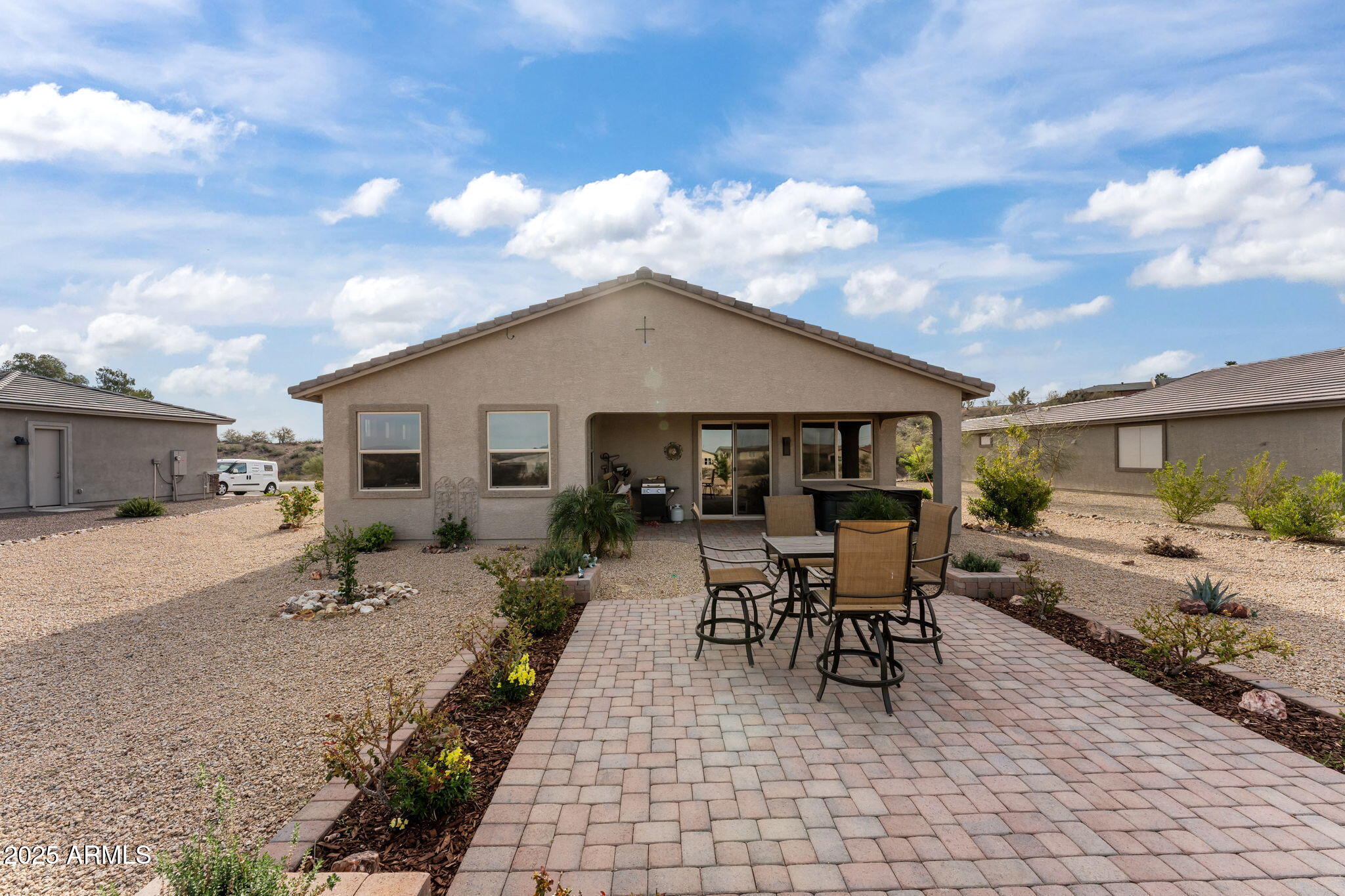 1900 West Ringo Road Wickenburg, AZ 85390 - Photo 30 of 37 a view of a backyard with sitting area