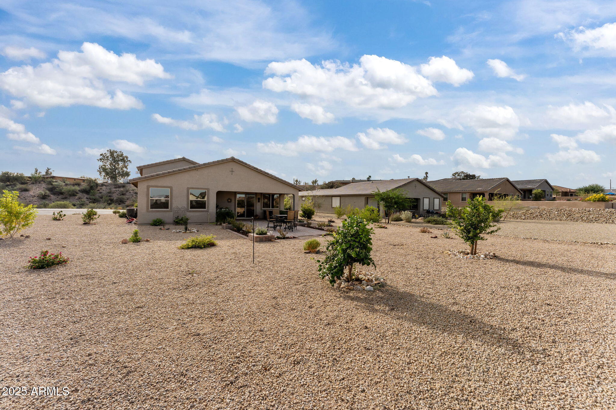 1900 West Ringo Road Wickenburg, AZ 85390 - Photo 31 of 37 a view of a house with a yard