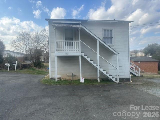 4911 Monroe Road Charlotte, NC 28205 - Photo 1 of 15 a view of a house with a yard