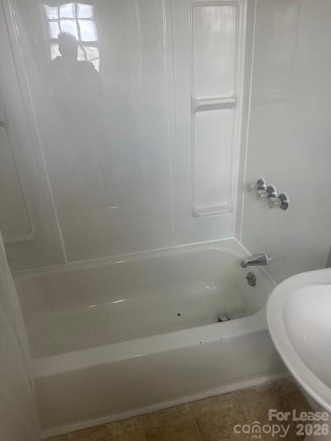 4911 Monroe Road Charlotte, NC 28205 - Photo 12 of 15 a bathroom with a bathtub