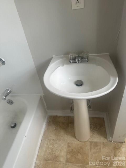 4911 Monroe Road Charlotte, NC 28205 - Photo 14 of 15 a bathroom with a sink