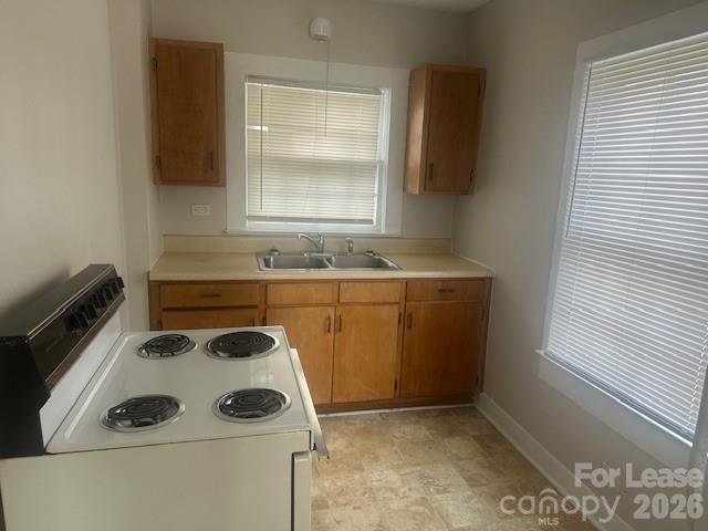 4911 Monroe Road Charlotte, NC 28205 - Photo 5 of 15 a utility room with sink dryer and washer