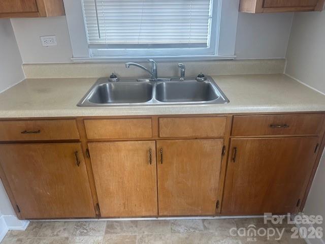 4911 Monroe Road Charlotte, NC 28205 - Photo 8 of 15 a kitchen with a sink and a refrigerator