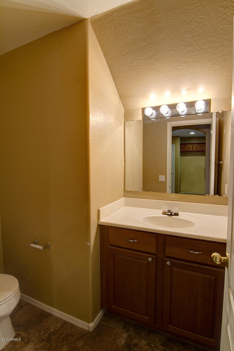 2404 West Roy Rogers Road Phoenix, AZ 85085 - Photo 17 of 35 a bathroom with a granite countertop sink and a mirror