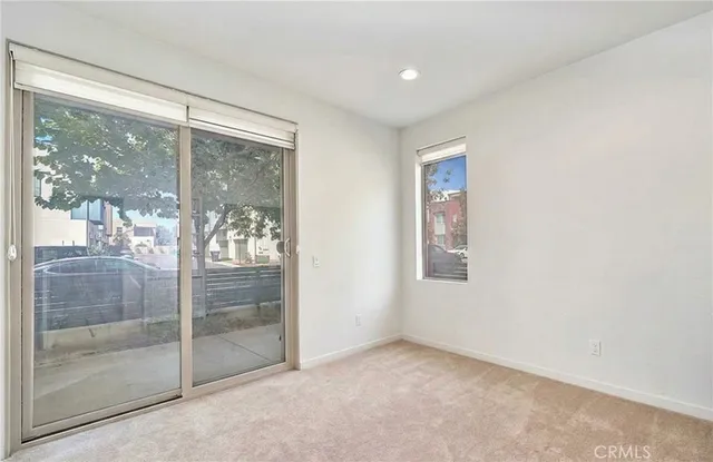 a view of an empty room with glass door