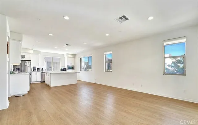 a view of kitchen with cabinets and wooden floor