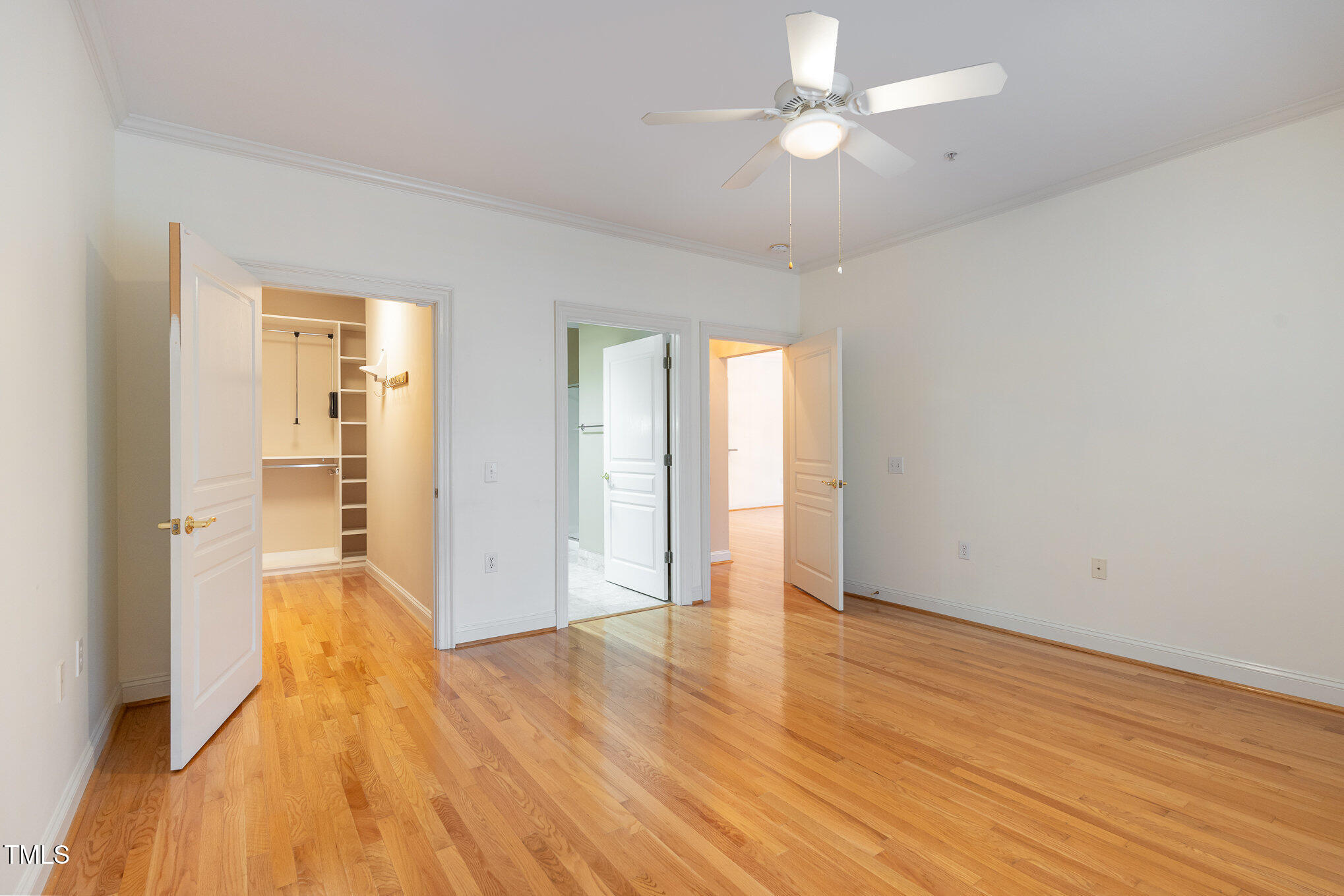 7530 Lead Mine Road, Unit 102 Raleigh, NC 27615 - Photo 11 of 18 an empty room with wooden floor and windows