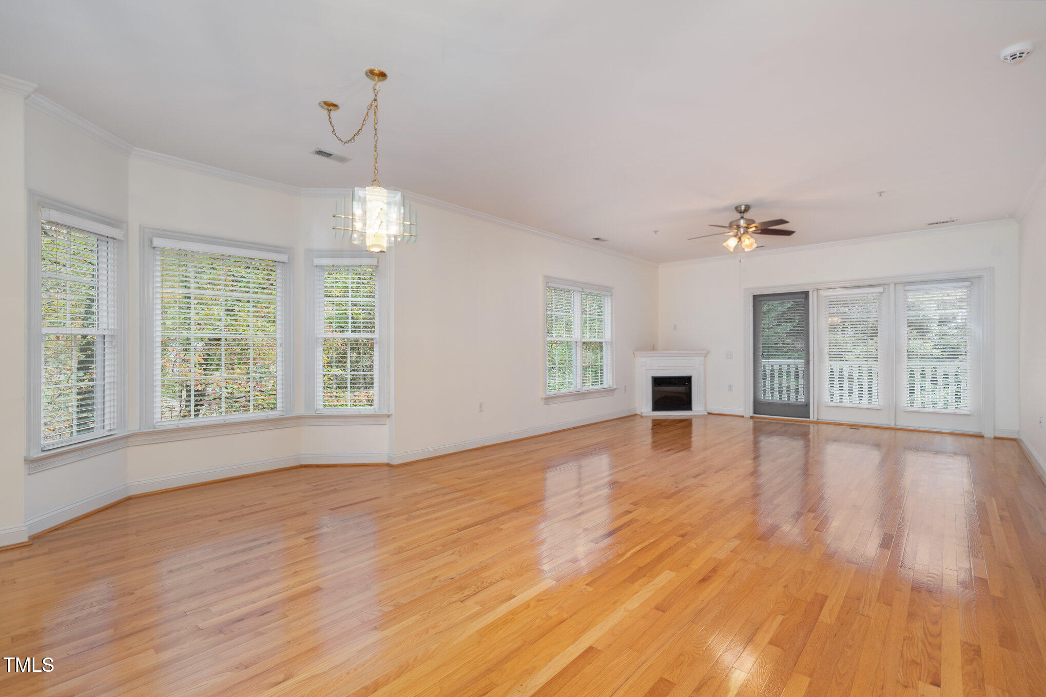 7530 Lead Mine Road, Unit 102 Raleigh, NC 27615 - Photo 7 of 18 a view of livingroom with window hardwood floor and cabinet