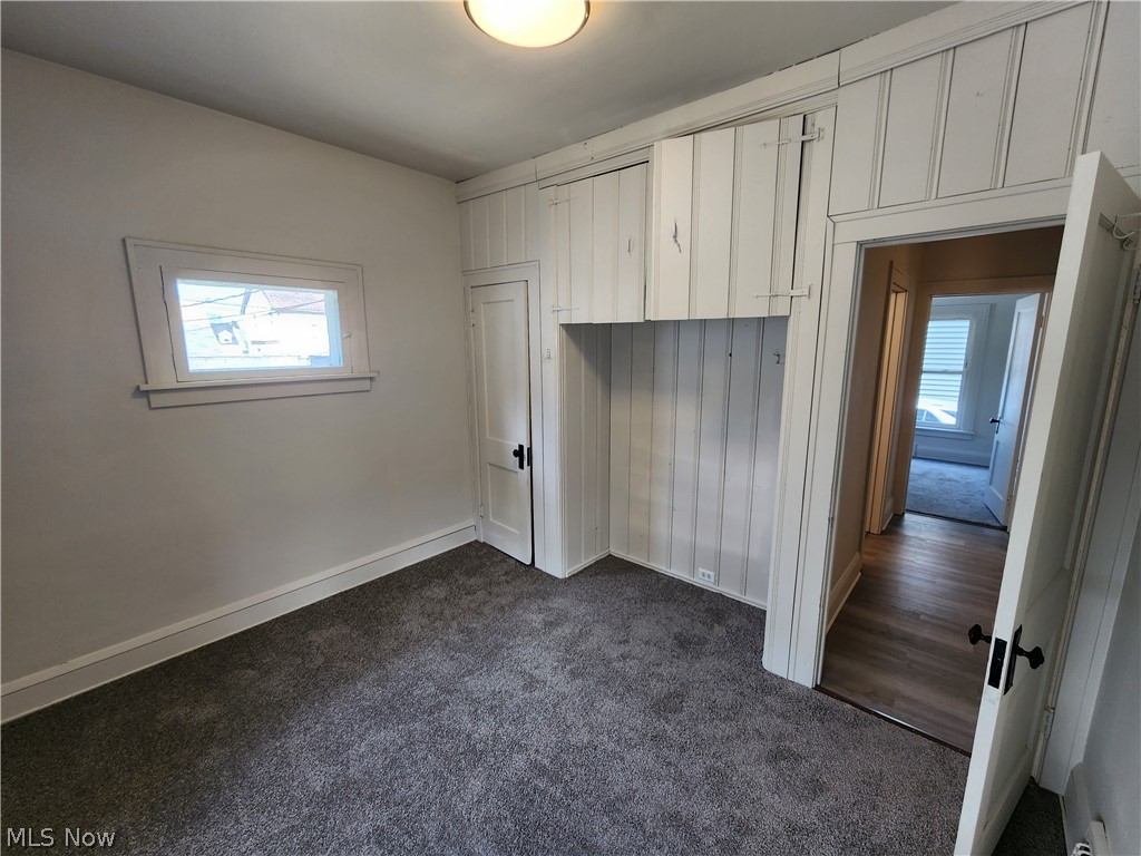 7202 Snow Road Parma, OH 44129 - Photo 10 of 14 Unfurnished bedroom with dark wood-type flooring