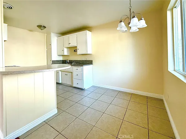 a kitchen with stainless steel appliances a stove a sink a microwave and cabinets