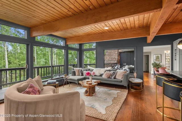 a bathroom with a granite countertop sink mirror and shower