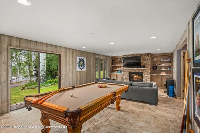 a bedroom with a bed and a television