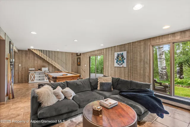 a bathroom with a double vanity sink and mirror with shower