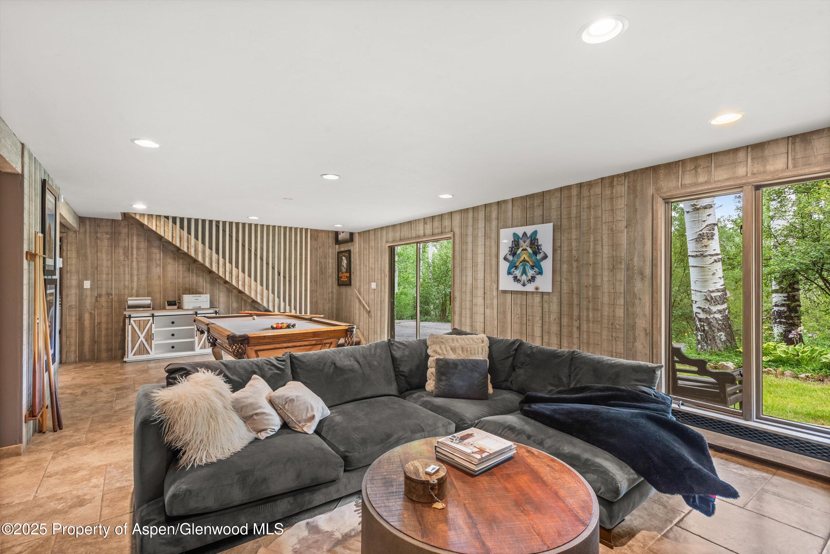 49 Elk Ridge Lane Snowmass Village, CO 81615 - Photo 21 of 38 a living room with furniture and a large window
