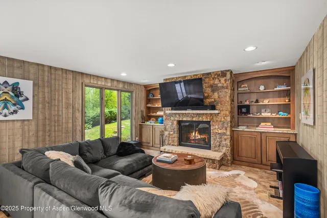 a bathroom with a granite countertop sink toilet mirror and shower