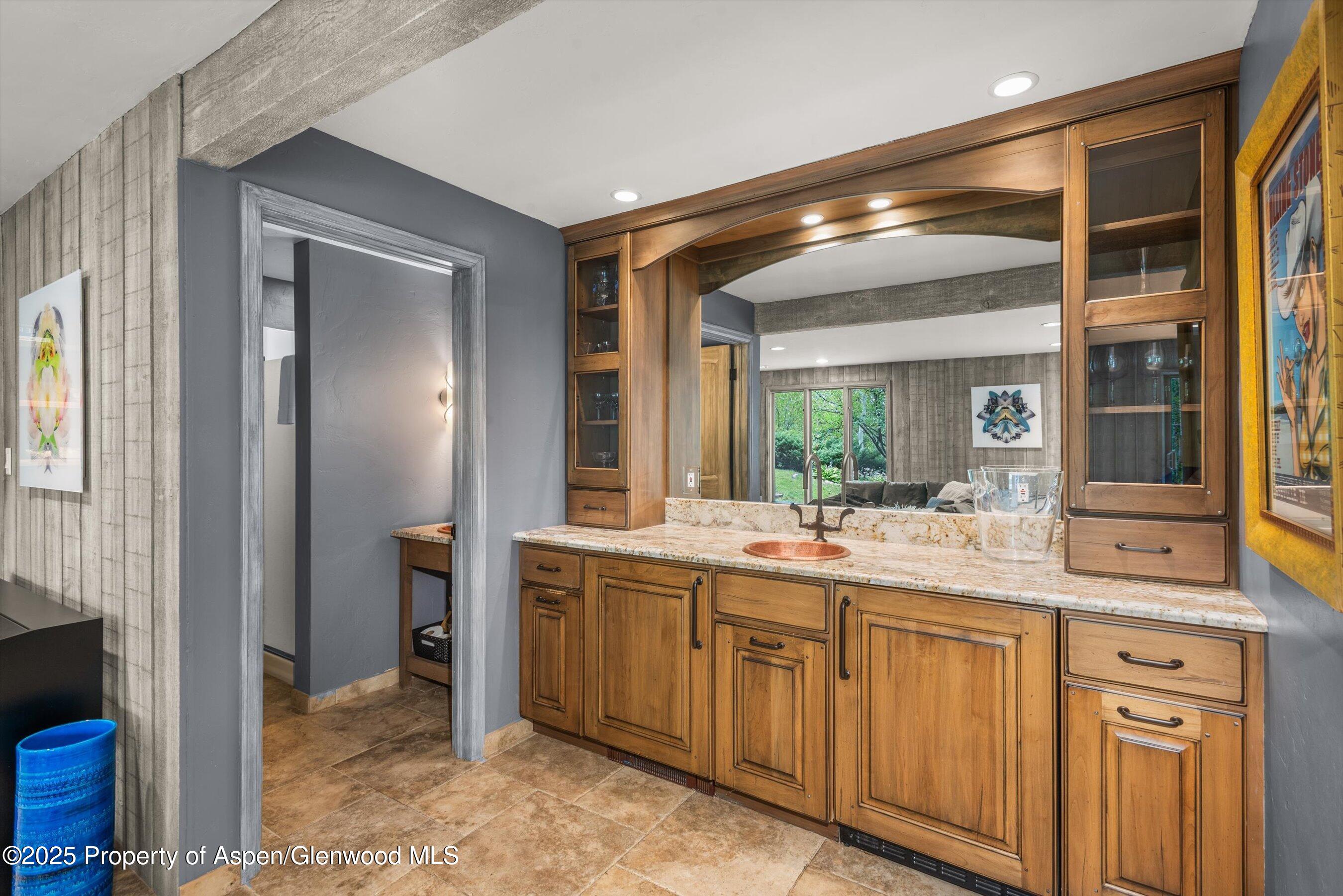 49 Elk Ridge Lane Snowmass Village, CO 81615 - Photo 24 of 38 a bathroom with a sink and mirror