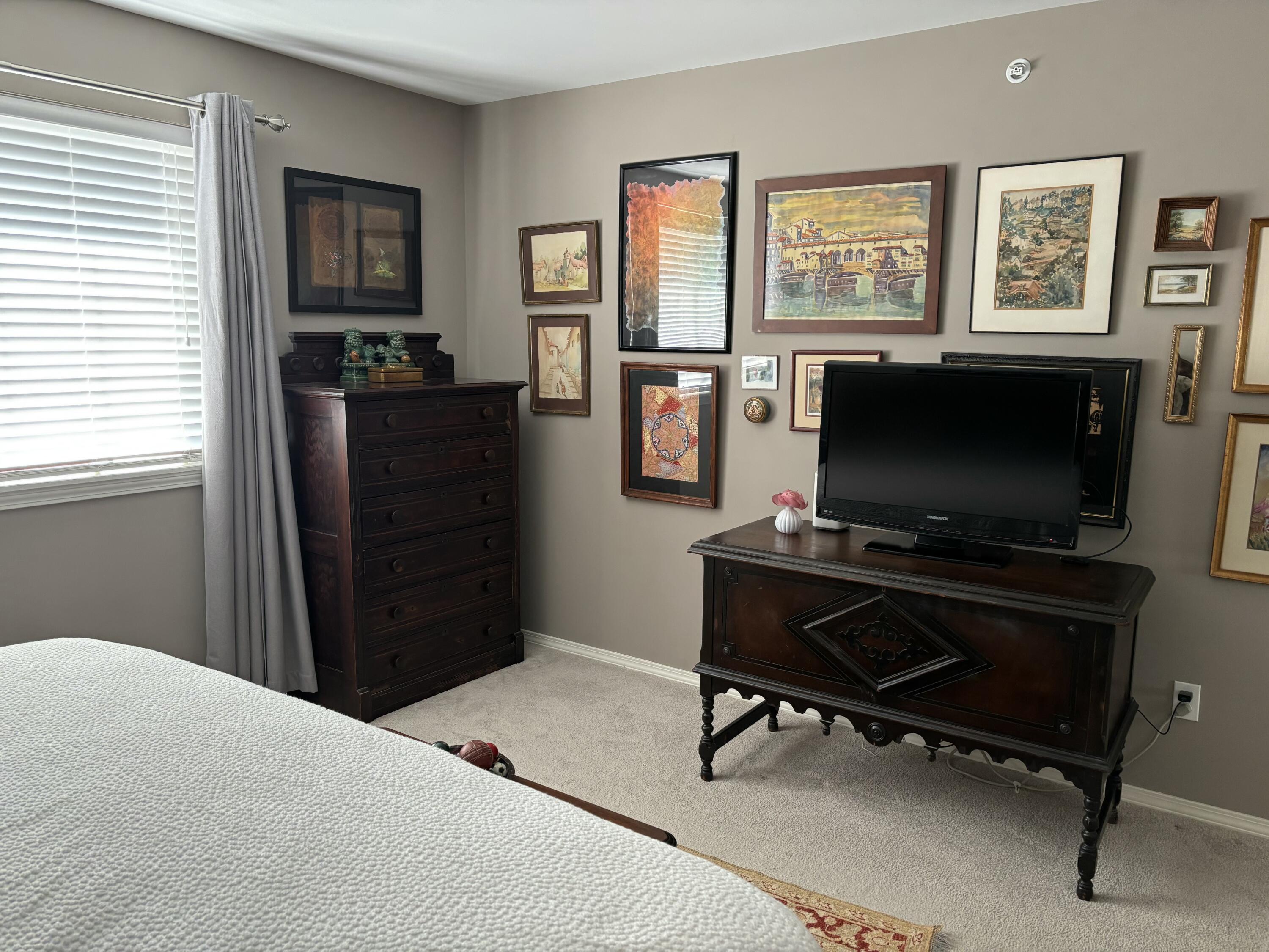 406 Sturdy Road, Unit A12 Valparaiso, IN 46383 - Photo 14 of 20 a bedroom with a bed and a flat screen tv