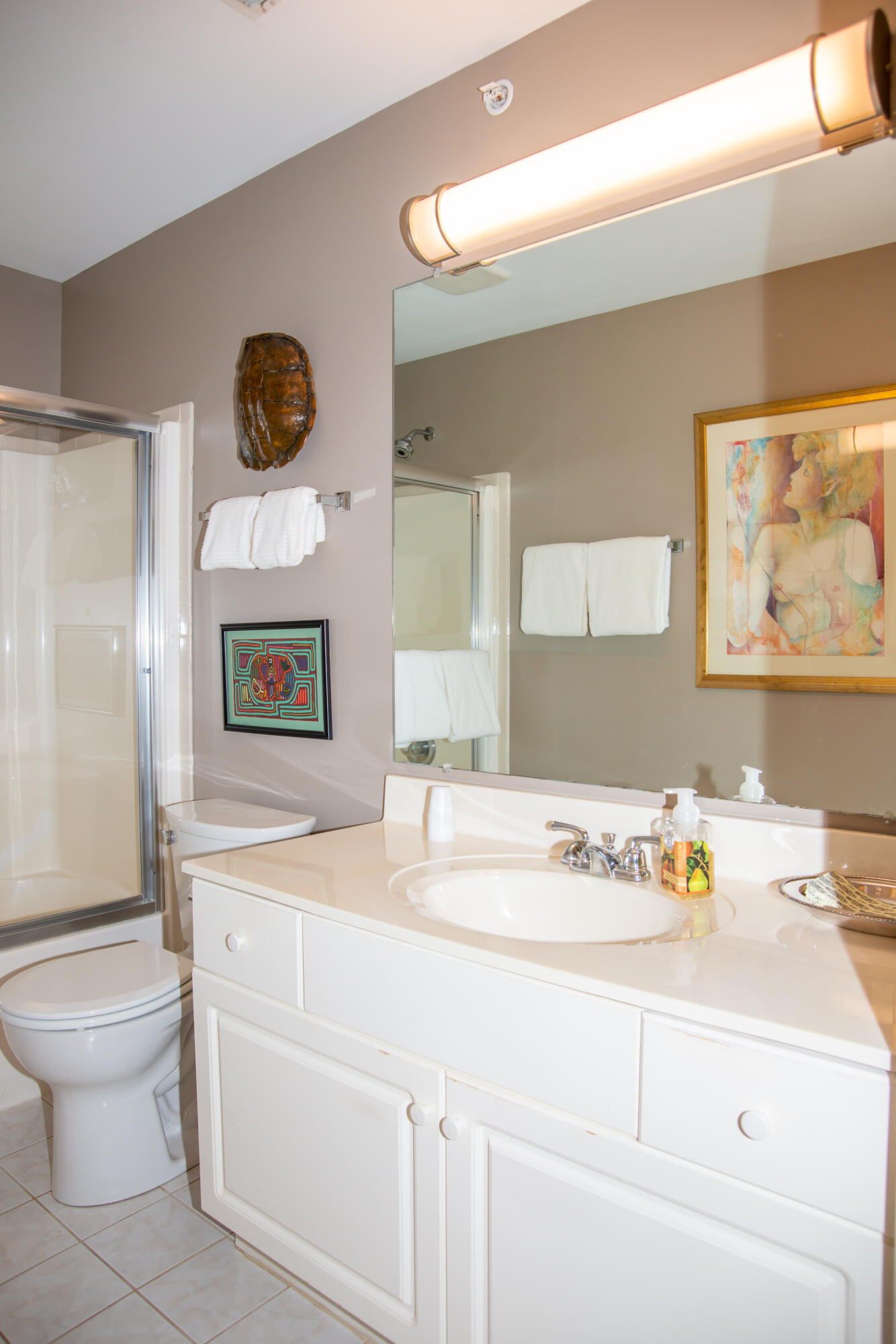 406 Sturdy Road, Unit A12 Valparaiso, IN 46383 - Photo 17 of 20 a bathroom with a sink a toilet and a mirror