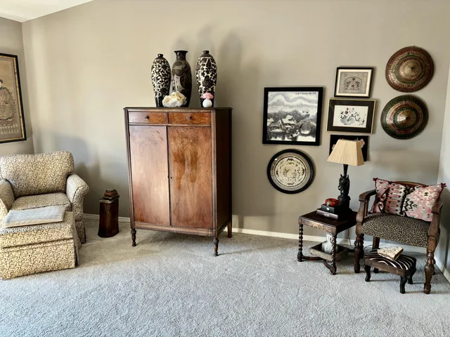 a dining room with furniture and window