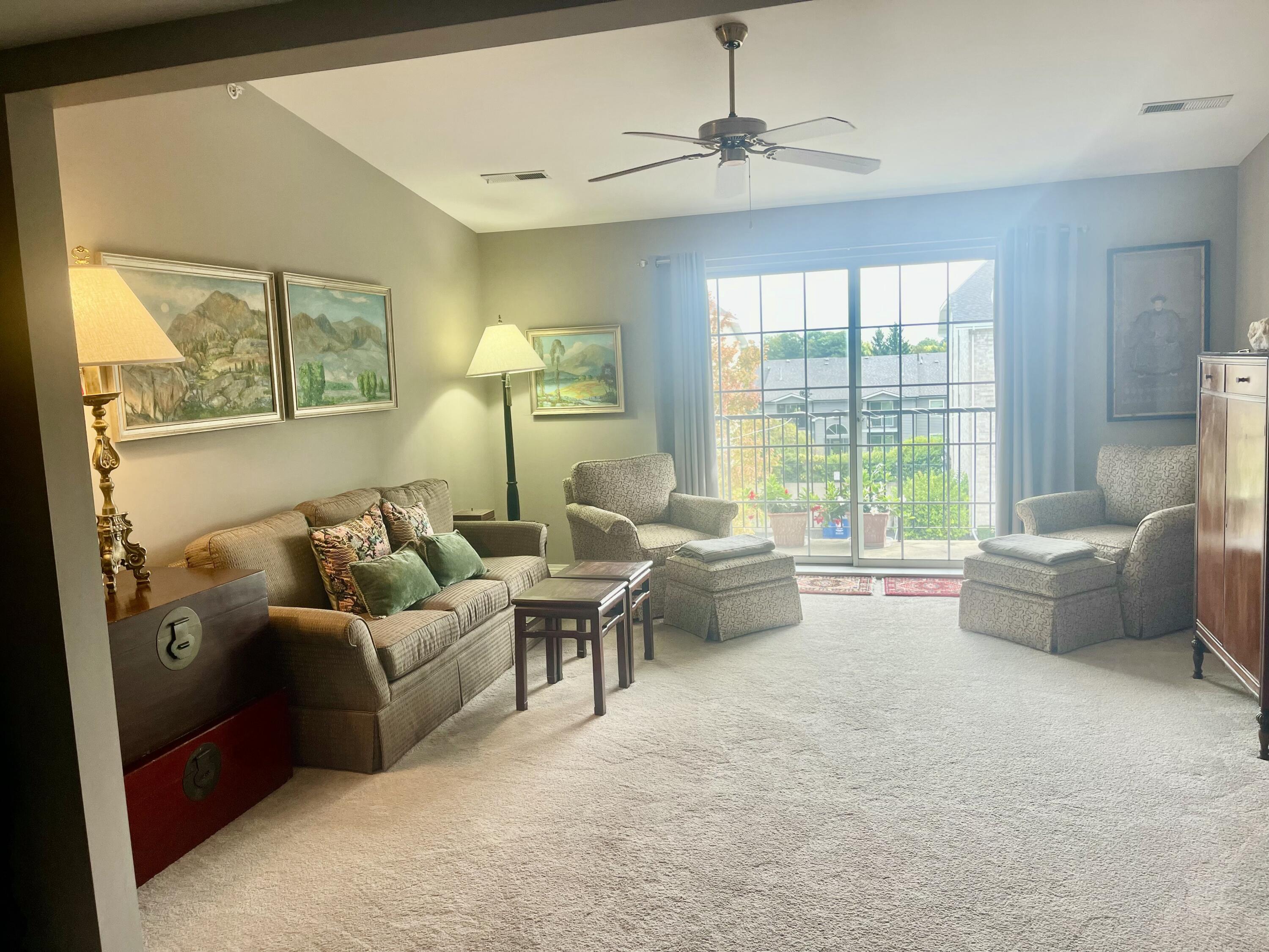 406 Sturdy Road, Unit A12 Valparaiso, IN 46383 - Photo 8 of 20 a living room with furniture and a large window