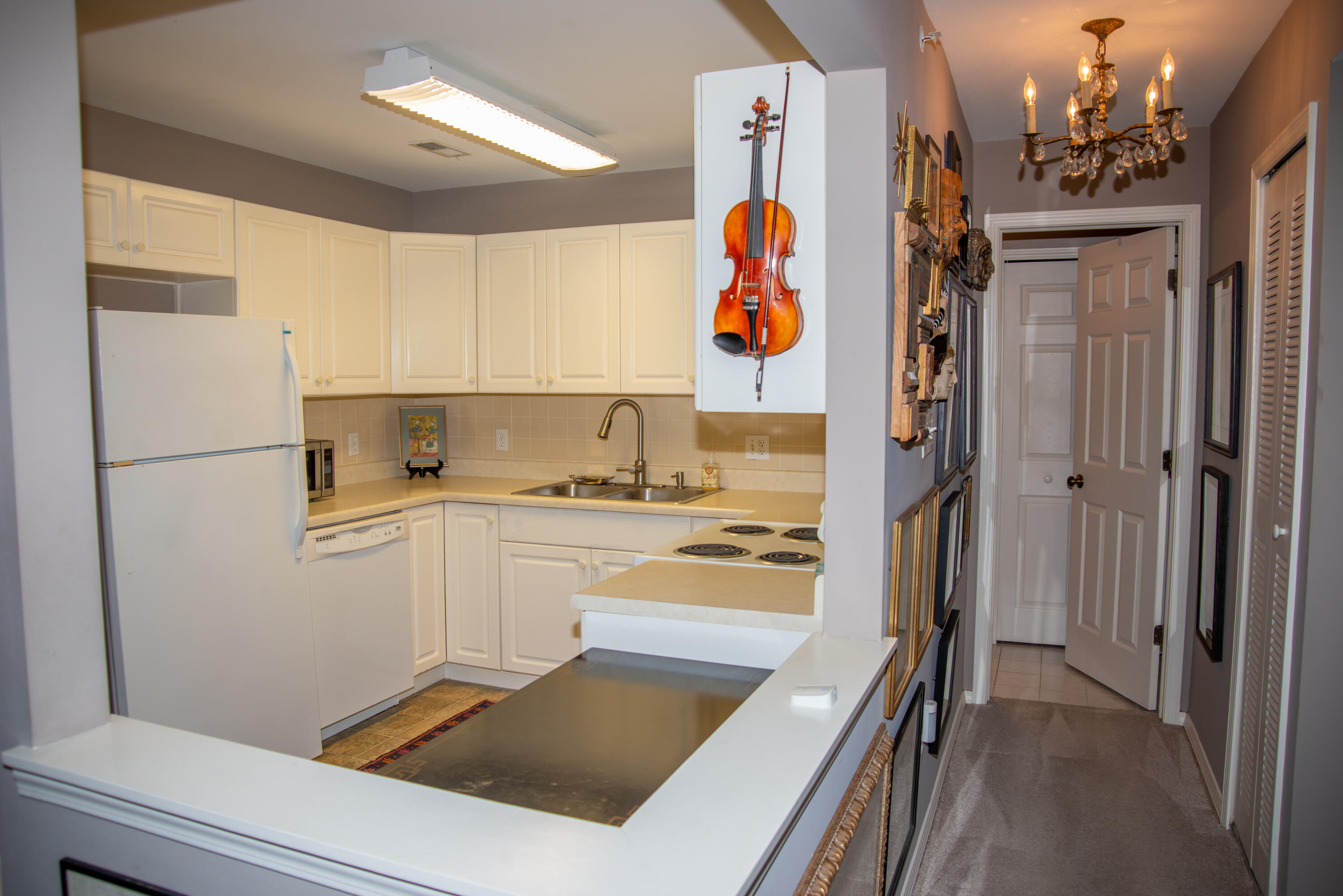 406 Sturdy Road, Unit A12 Valparaiso, IN 46383 - Photo 9 of 20 a kitchen with a refrigerator and a stove
