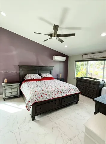 a bedroom with a bed and dresser