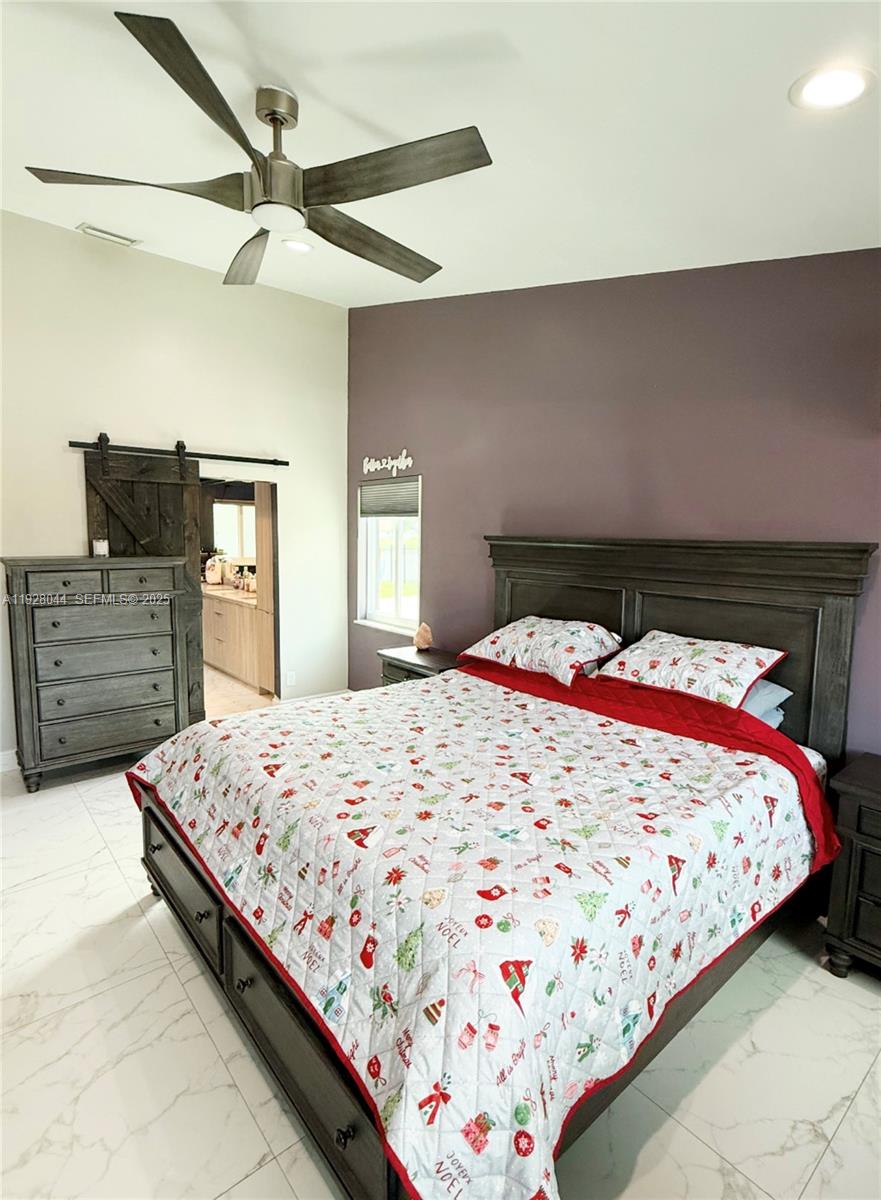 15500 Carriage Court Davie, FL 33331 - Photo 14 of 26 a bedroom with a bed and dresser