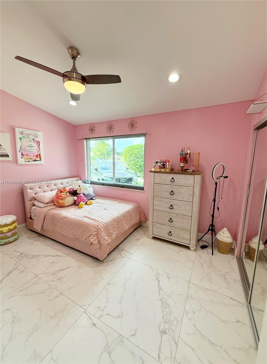 15500 Carriage Court Davie, FL 33331 - Photo 18 of 26 a bedroom with a bed and a window