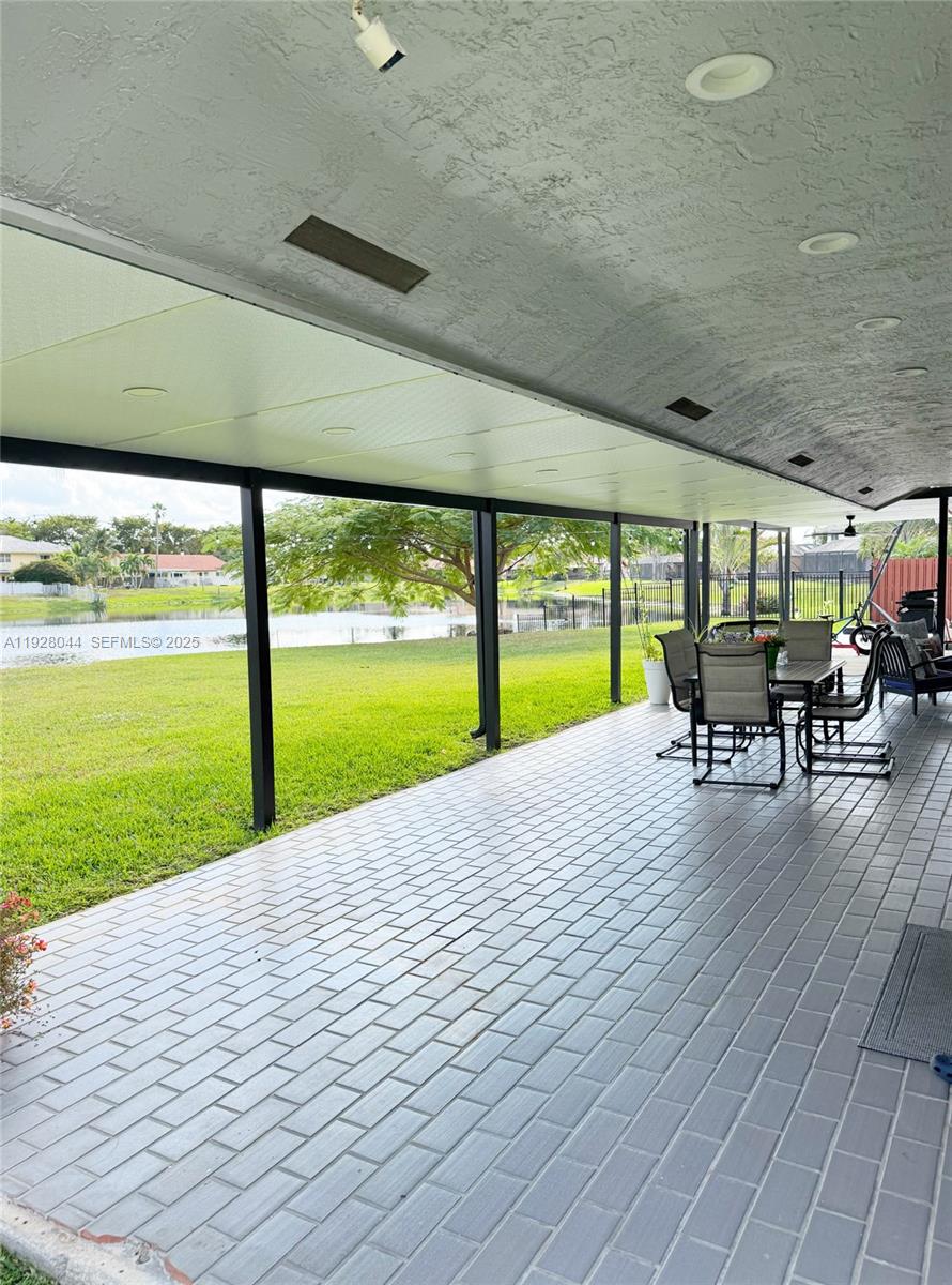 15500 Carriage Court Davie, FL 33331 - Photo 19 of 26 a view of a swimming pool and outdoor space
