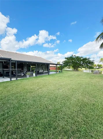 a view of field with a big yard